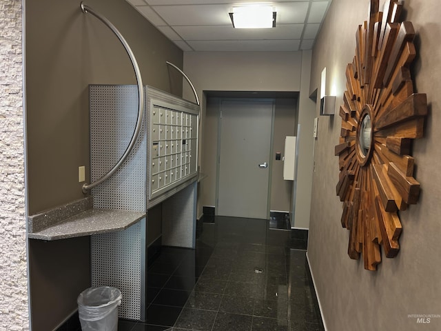 199 N Capitol Blvd, Boise, ID 83702 - hall with mail area, a paneled ceiling, and tile patterned flooring