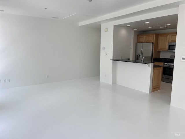 199 N Capitol Blvd, Boise, ID 83702 - kitchen with appliances with stainless steel finishes, dark countertops, concrete flooring, recessed lighting, and a peninsula