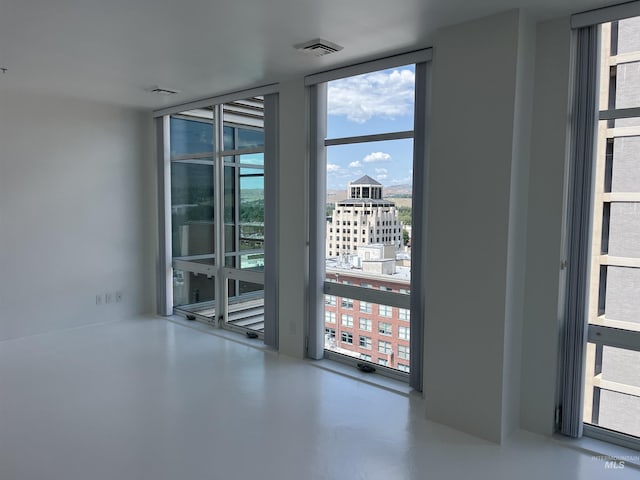 199 N Capitol Blvd, Boise, ID 83702 - spare room with a wall of windows and finished concrete floors