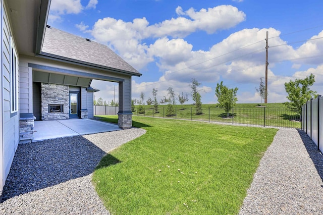 5696 W Polecat Dr, Eagle, ID 83616 - view of yard with a stone fireplace and a patio