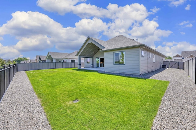 5696 W Polecat Dr, Eagle, ID 83616 - back of property with a patio area, cooling unit, a gate, and a shingled roof