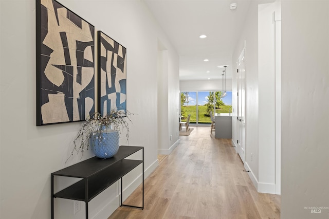 5696 W Polecat Dr, Eagle, ID 83616 - corridor featuring light wood finished floors, baseboards, and recessed lighting
