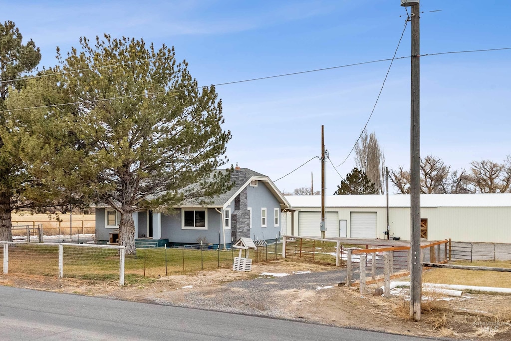 view of front facade with a garage and a front lawn