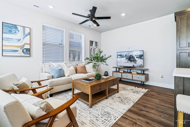 living room featuring a ceiling fan, dark wood-style floors, visible vents, baseboards, and recessed lighting