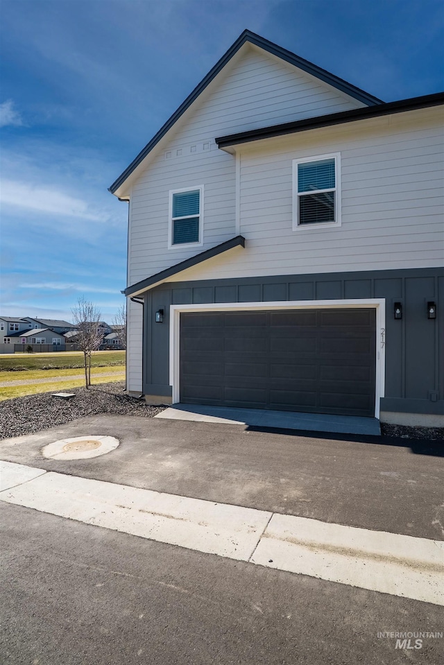 exterior space with driveway and a garage