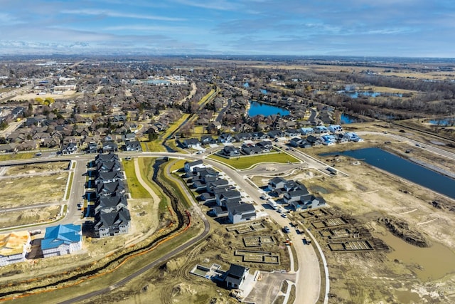 bird's eye view featuring a water view and a residential view