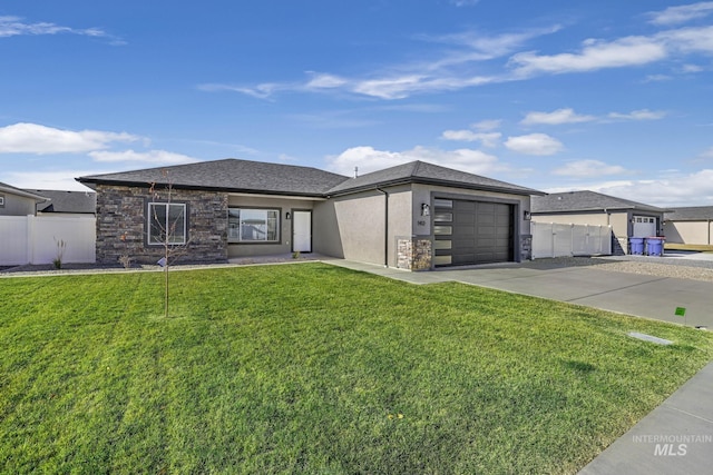 prairie-style house with a garage and a front yard