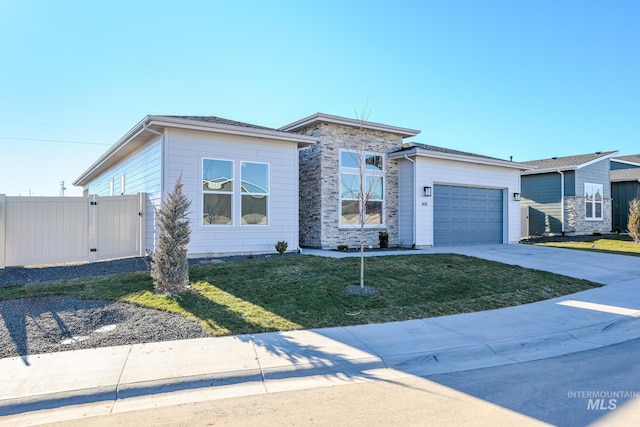 view of front of house with a front yard and a garage