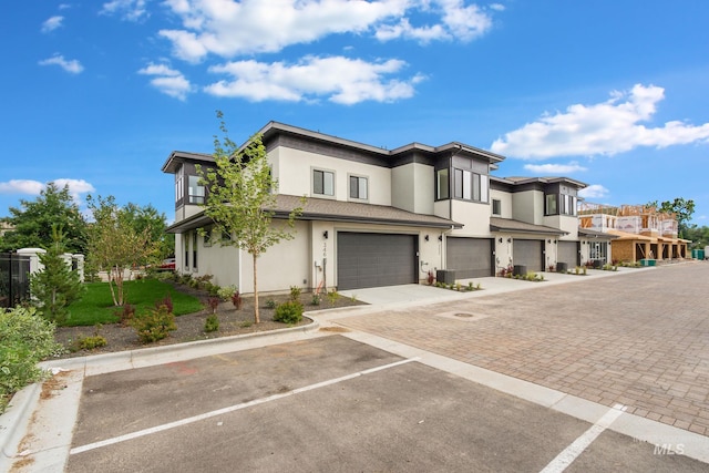 townhome / multi-family property featuring a garage