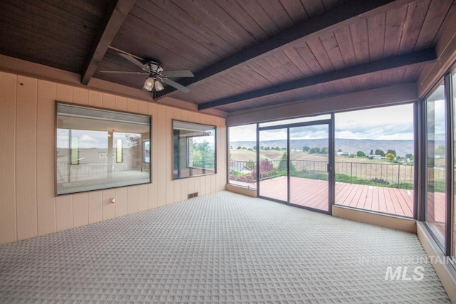 2634 Laurel Ct, Clarkston, WA 99403 - unfurnished sunroom with beam ceiling, a ceiling fan, carpet, wood walls, and wood ceiling