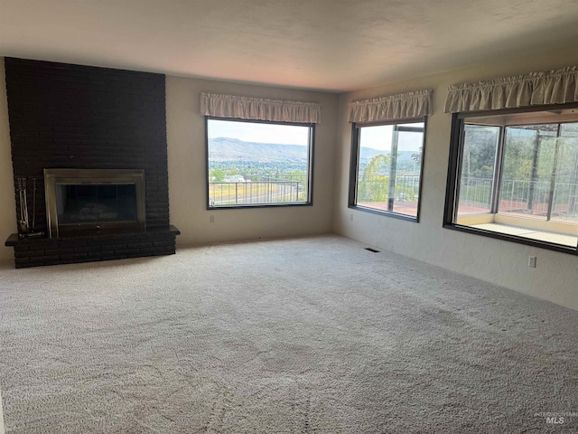 2634 Laurel Ct, Clarkston, WA 99403 - unfurnished living room featuring carpet floors and a fireplace