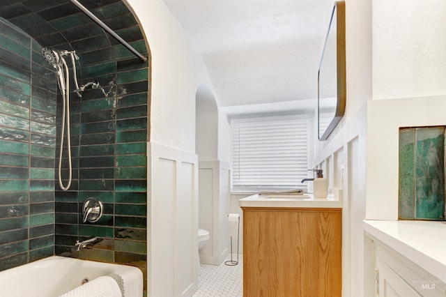 312 4th Ave, Lewiston, ID 83501 - bathroom with vanity,  shower combination, toilet, and a wainscoted wall
