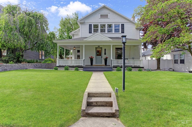 312 4th Ave, Lewiston, ID 83501 - victorian-style house featuring covered porch and a front lawn