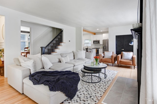 312 4th Ave, Lewiston, ID 83501 - living area with light wood-style flooring and stairs