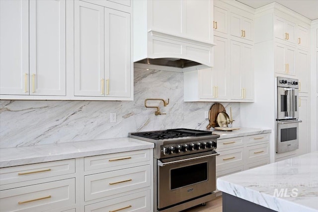8 River Run Ests, Burley, ID 83318 - kitchen with stainless steel appliances, backsplash, white cabinets, and light stone counters