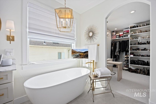 8 River Run Ests, Burley, ID 83318 - full bathroom featuring a soaking tub, a spacious closet, and vanity