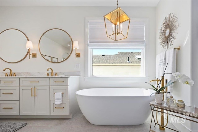 8 River Run Ests, Burley, ID 83318 - full bathroom featuring vanity, a freestanding tub, a chandelier, and tile patterned flooring