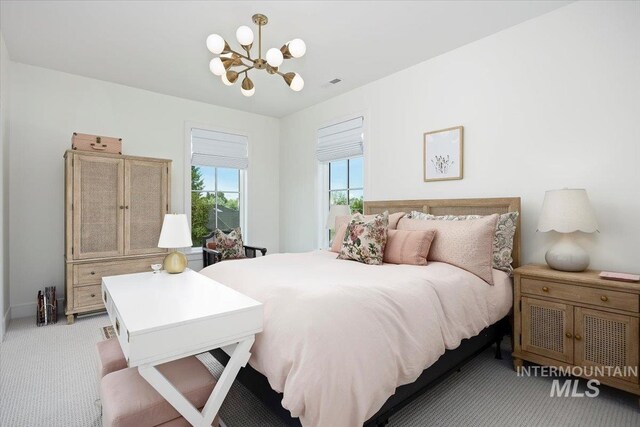 8 River Run Ests, Burley, ID 83318 - bedroom with a chandelier and light carpet