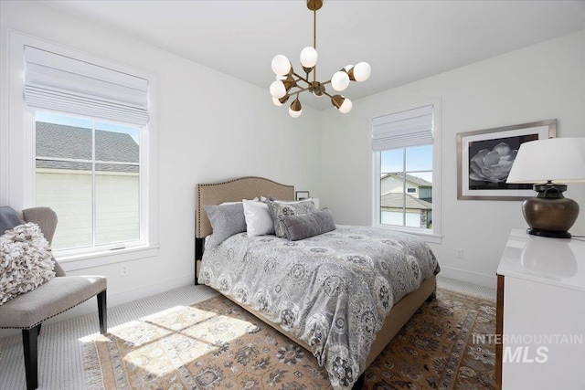 8 River Run Ests, Burley, ID 83318 - bedroom featuring a chandelier, carpet, multiple windows, and baseboards