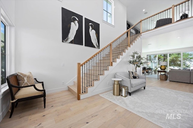 8 River Run Ests, Burley, ID 83318 - stairway with plenty of natural light, wood finished floors, a towering ceiling, baseboards, and recessed lighting