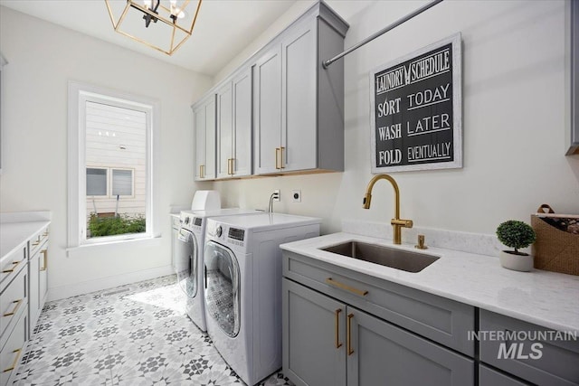 8 River Run Ests, Burley, ID 83318 - washroom with cabinet space, separate washer and dryer, baseboards, and a chandelier