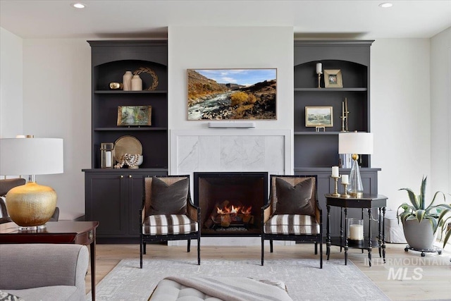 8 River Run Ests, Burley, ID 83318 - living area featuring built in features, a premium fireplace, wood finished floors, and recessed lighting