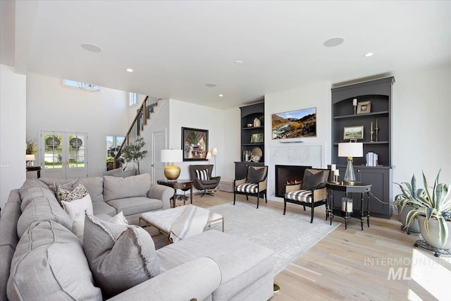 8 River Run Ests, Burley, ID 83318 - living area with stairway, light wood-type flooring, built in features, a premium fireplace, and recessed lighting