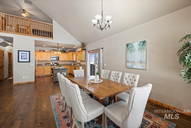 dining room with ceiling fan with notable chandelier, dark hardwood / wood-style flooring, and high vaulted ceiling