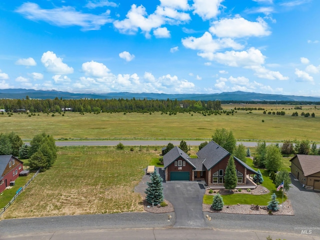 birds eye view of property with a mountain view and a rural view