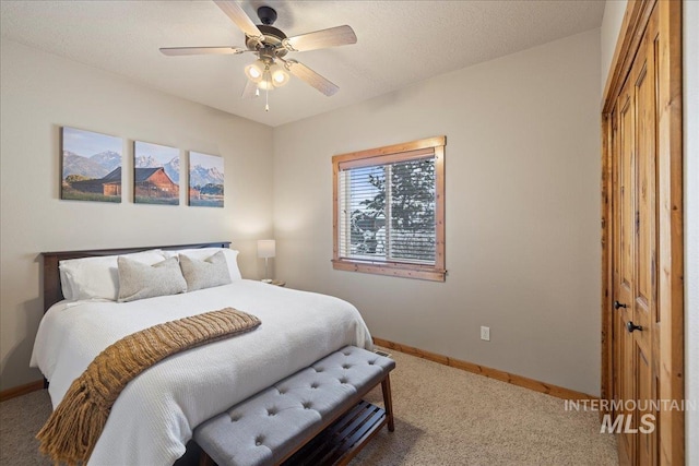 bedroom with carpet, a closet, and ceiling fan