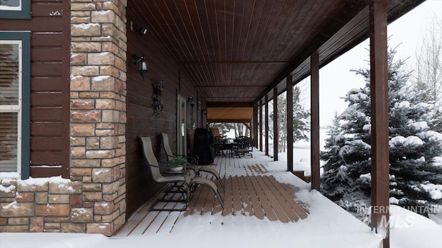 view of snow covered deck