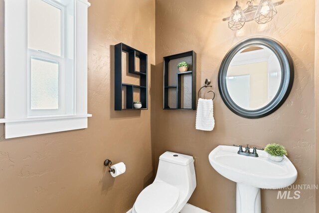 bathroom featuring toilet and a sink