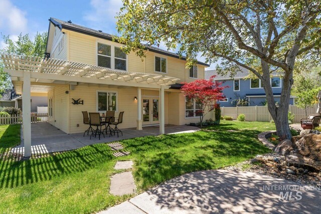back of house featuring french doors, a pergola, and a patio area