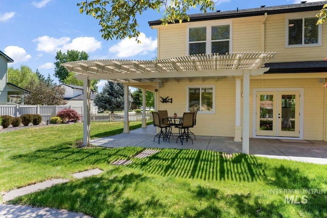 back of house with a pergola and a patio area