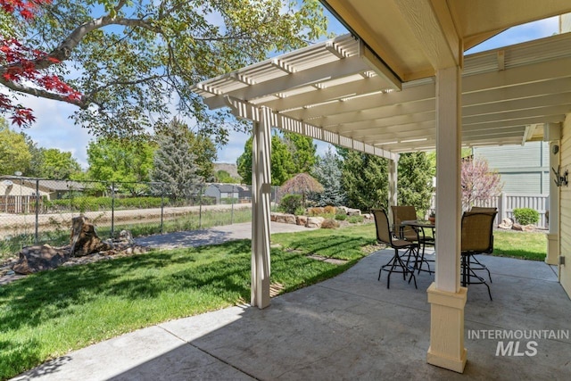 view of patio featuring a pergola and outdoor dining space