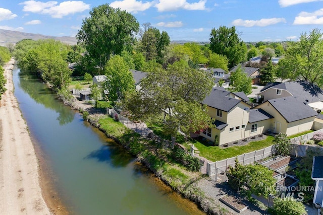 aerial view of residential area with a large body of water