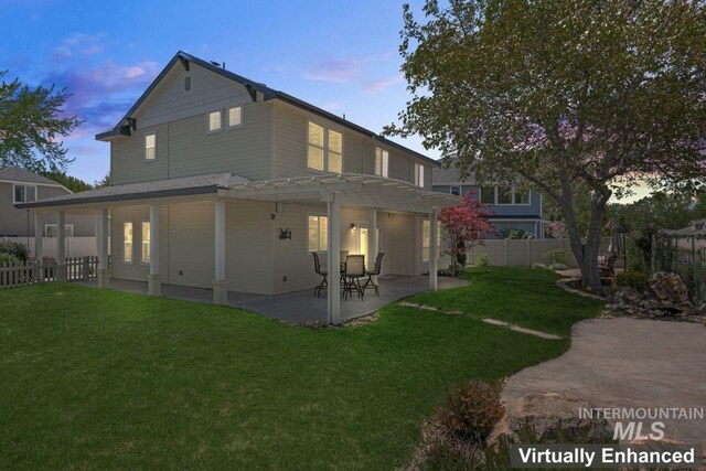 rear view of property with a pergola and a patio area