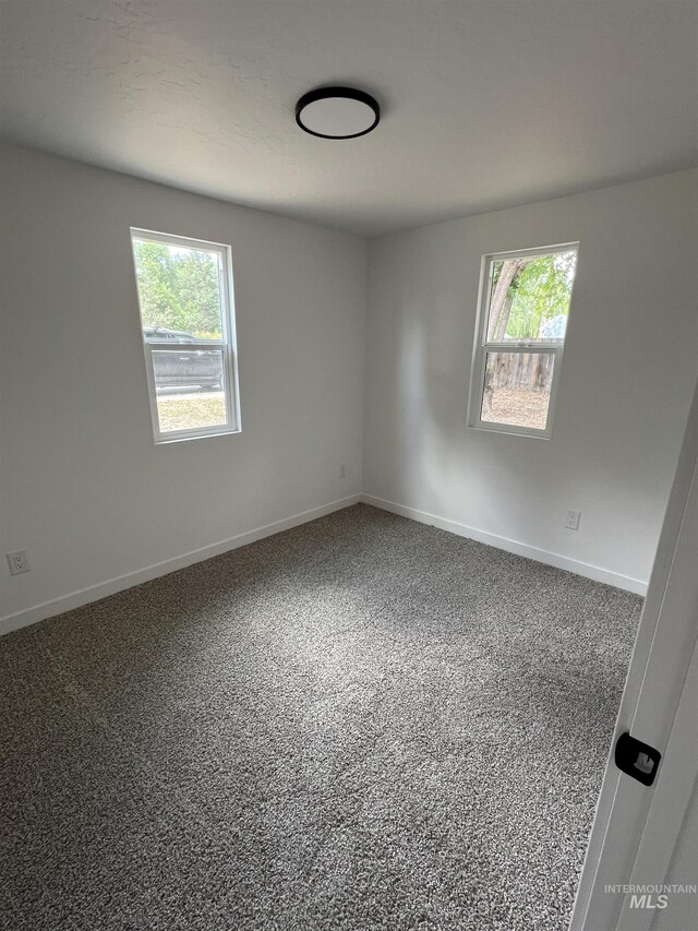 956 8th Ave N, Payette, ID 83661 - carpeted spare room with baseboards