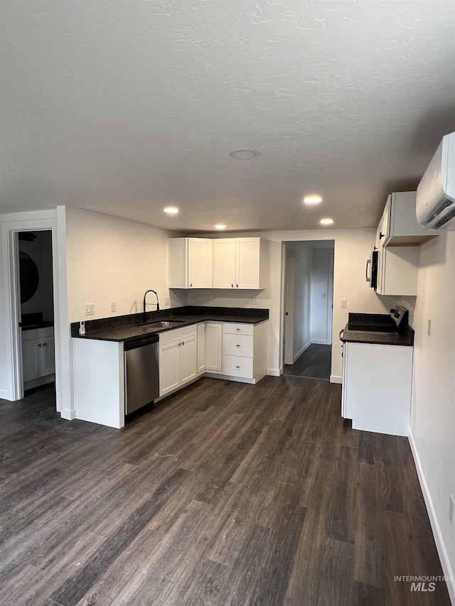 956 8th Ave N, Payette, ID 83661 - kitchen with stainless steel appliances, dark countertops, dark wood-style floors, an AC wall unit, and recessed lighting