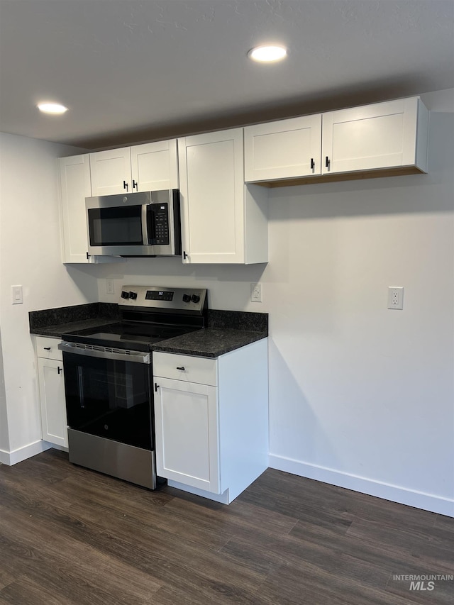 956 8th Ave N, Payette, ID 83661 - kitchen featuring stainless steel appliances, dark wood finished floors, white cabinets, and recessed lighting