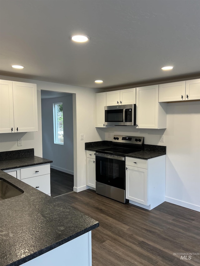956 8th Ave N, Payette, ID 83661 - kitchen featuring stainless steel appliances, white cabinetry, recessed lighting, and dark wood-type flooring