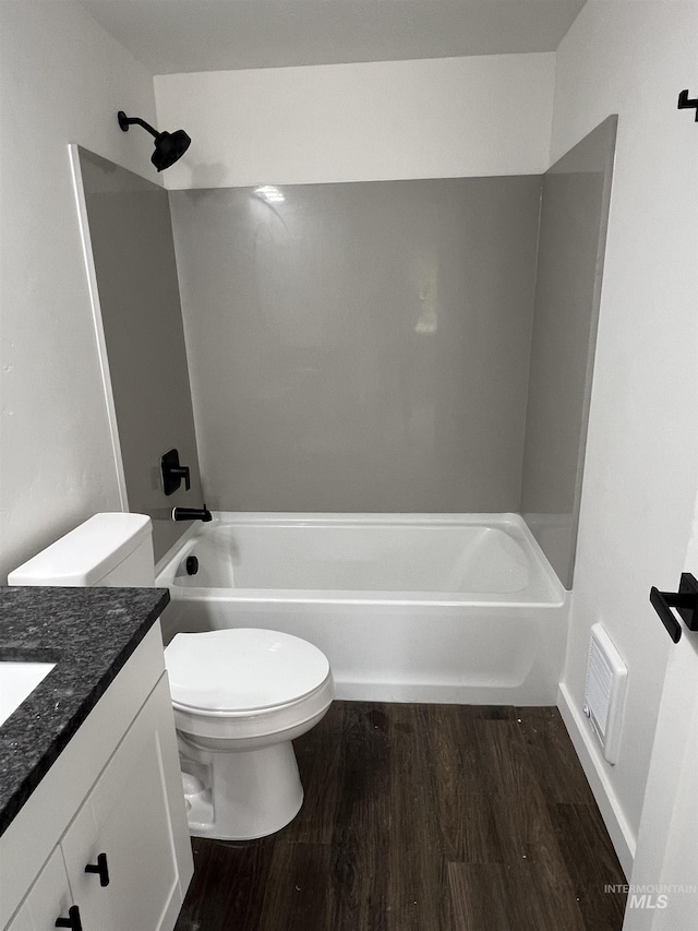 956 8th Ave N, Payette, ID 83661 - full bath featuring vanity, wood finished floors, and tub / shower combination