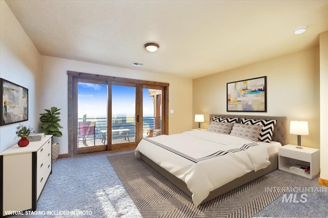 bedroom featuring a water view, access to exterior, and dark carpet