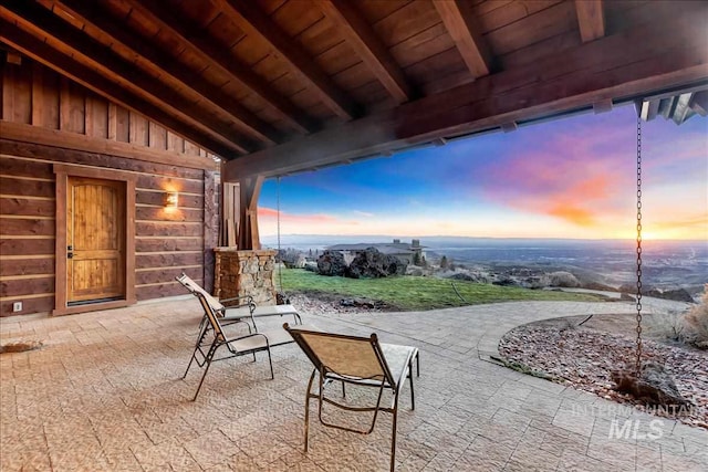 view of patio terrace at dusk