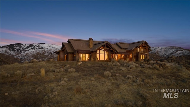 log-style house with a mountain view