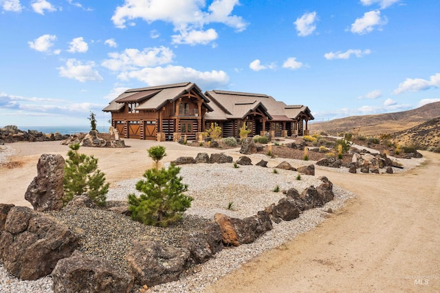 view of front of home with a mountain view