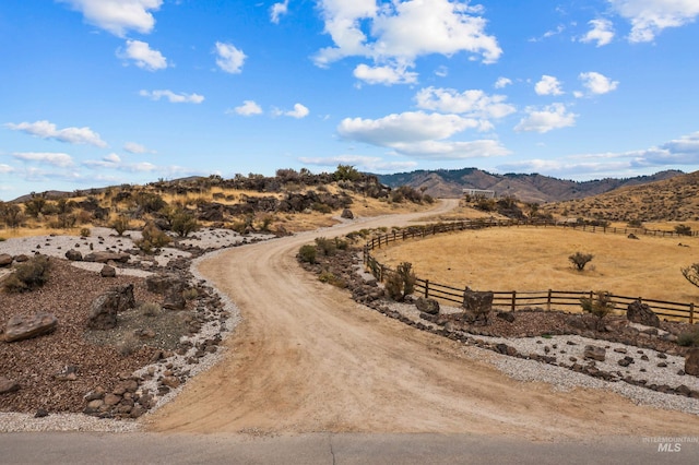 mountain view featuring a rural view