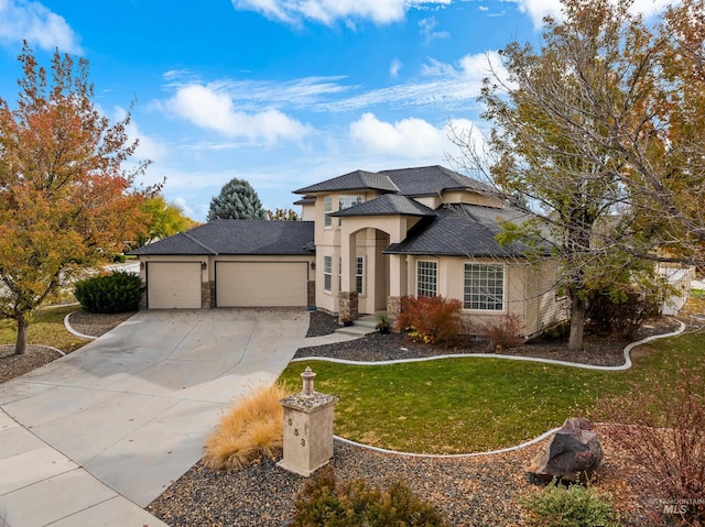 view of front facade with a front yard and a garage