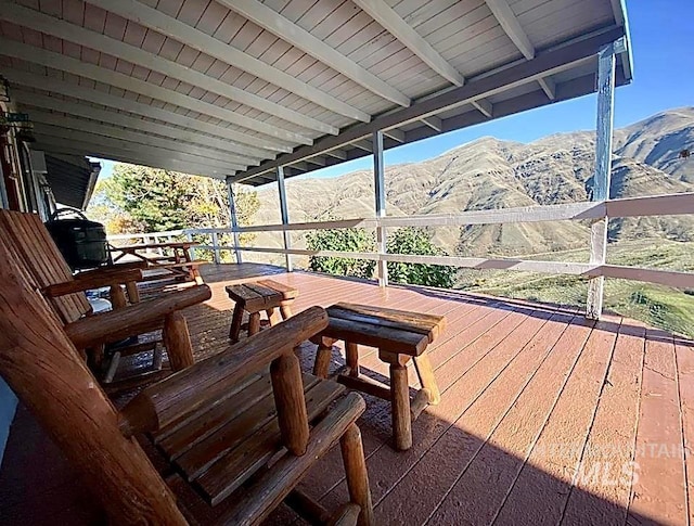 wooden terrace with a mountain view