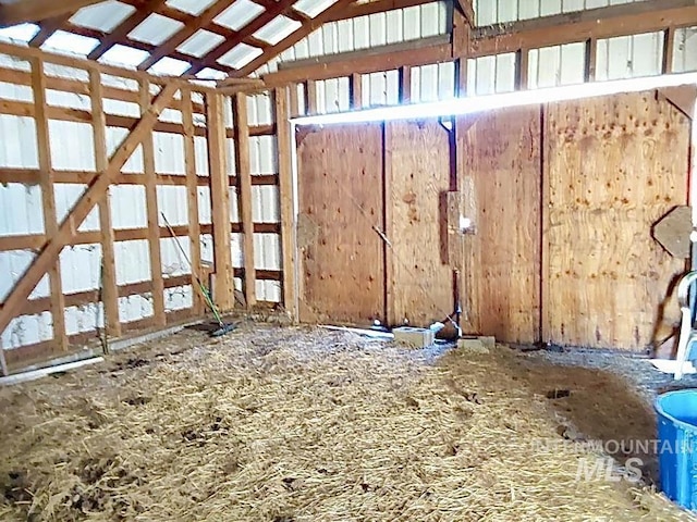 miscellaneous room with lofted ceiling